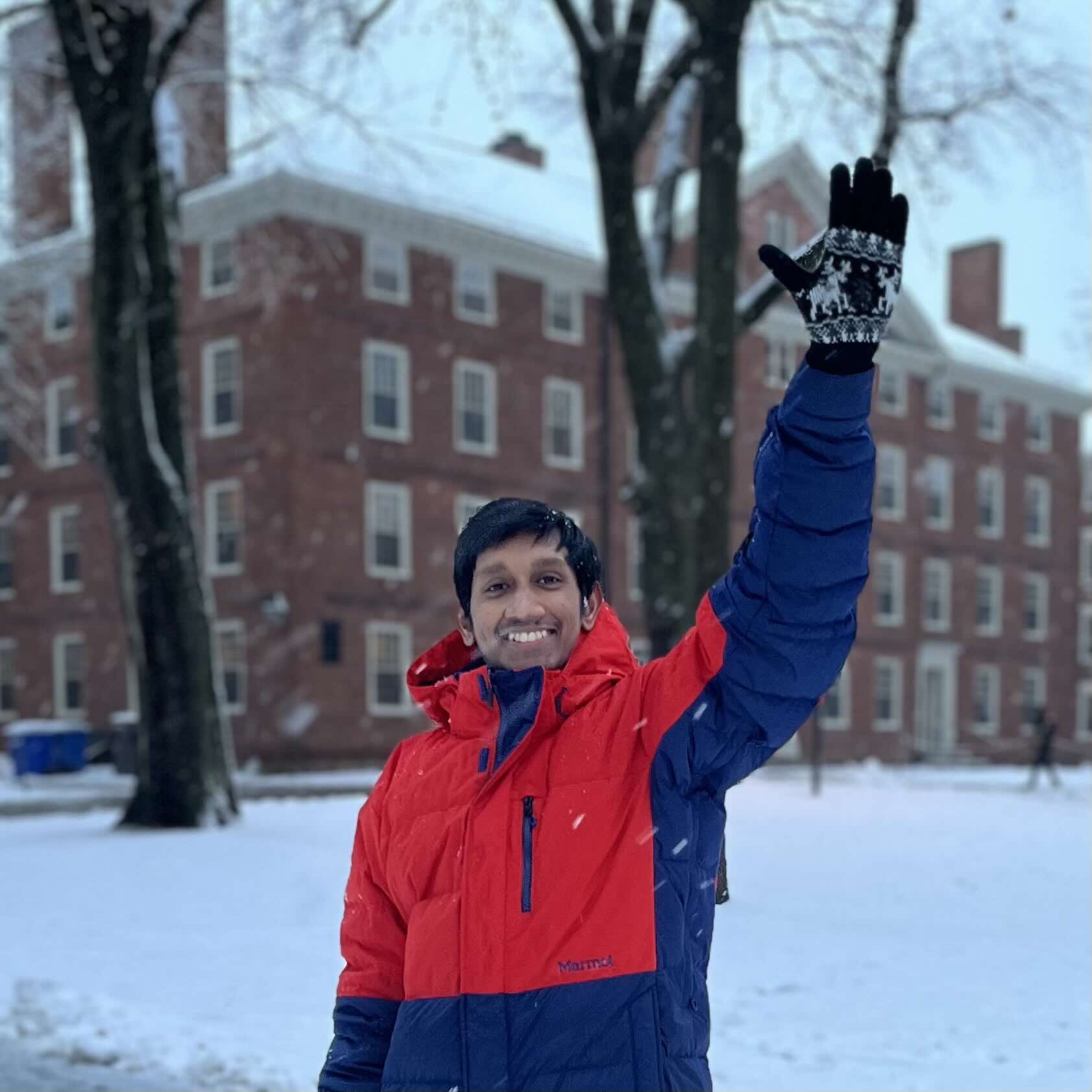 Ramith, smiling and waving at the camera